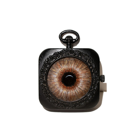 Image of Small Brown Eye in Metal Clock Frame by Autumn Justine Miller