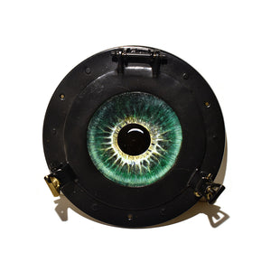 Image of Green Eye in Brass Portal by Autumn Justine Miller