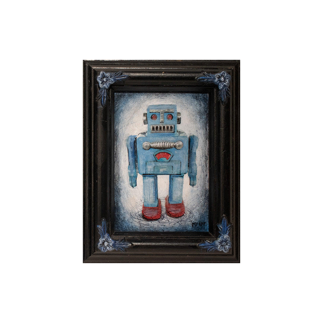 Image of Blue Toy Robot by Autumn Justine Miller